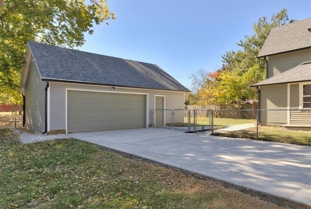 garage featuring a gate and fence