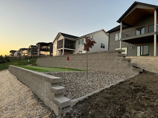 view of yard at dusk