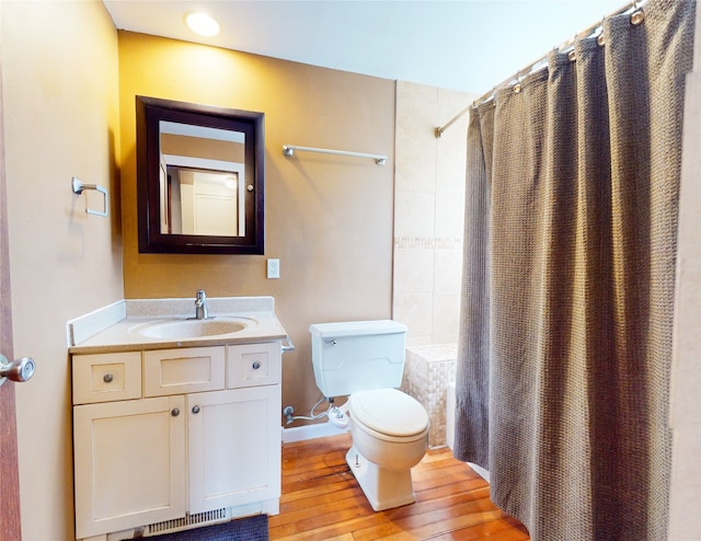 full bathroom with toilet, vanity, shower / bath combo, and wood-type flooring