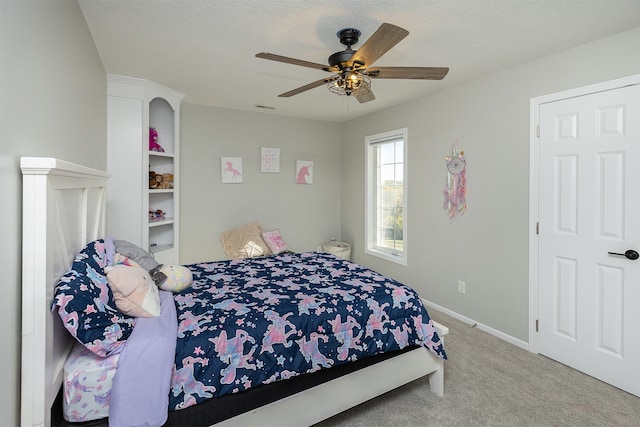 bedroom featuring a ceiling fan, carpet flooring, visible vents, and baseboards