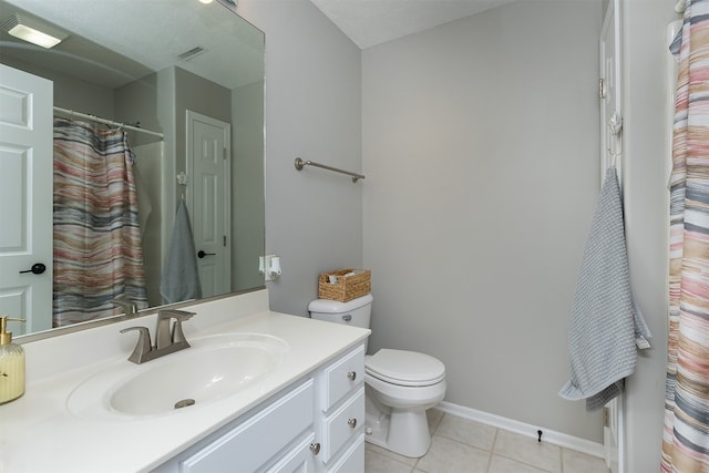 full bath with visible vents, toilet, vanity, baseboards, and tile patterned floors