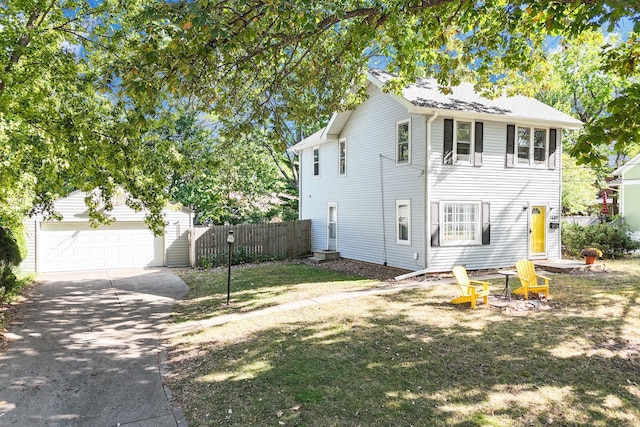 view of front of property featuring a front lawn and a garage