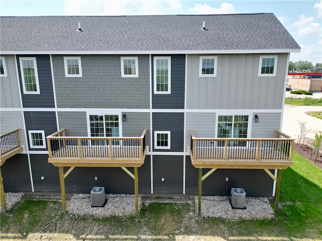 4424 154th St, Urbandale, IA 50323 - back of house with a wooden deck, board and batten siding, and a shingled roof