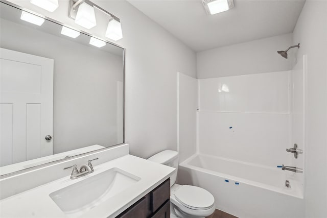 full bathroom with tub / shower combination, vanity, and toilet