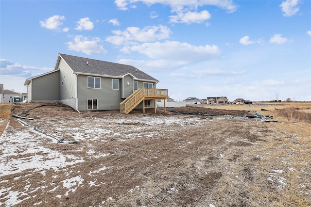 rear view of house with a wooden deck