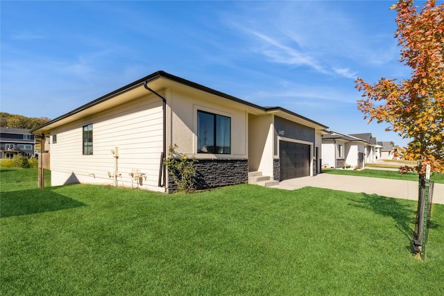 exterior space featuring a yard and a garage