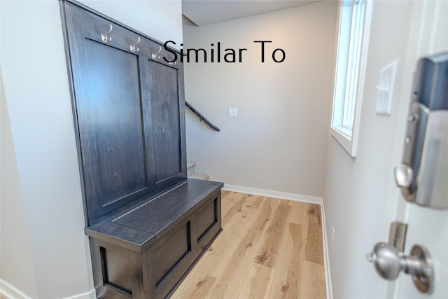 mudroom with baseboards and light wood finished floors