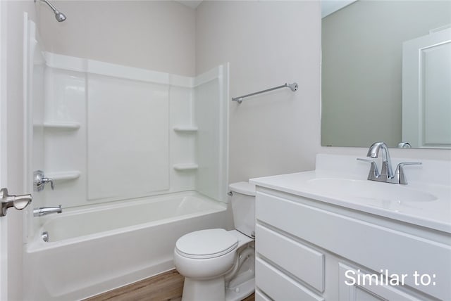 full bathroom featuring vanity, toilet, shower / washtub combination, and hardwood / wood-style floors