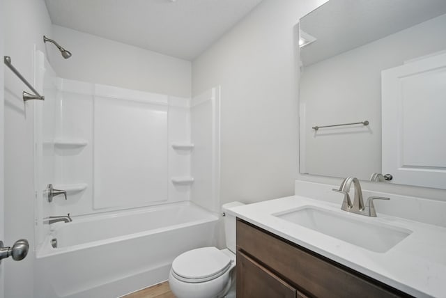 full bath featuring wood finished floors, toilet, shower / tub combination, and vanity