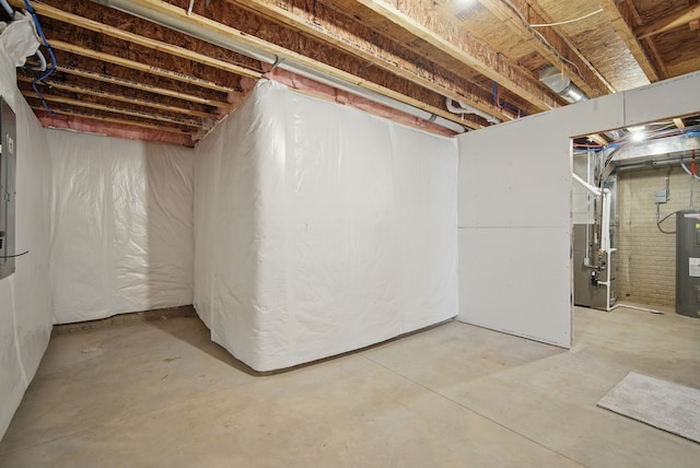 unfinished below grade area with water heater and heating unit