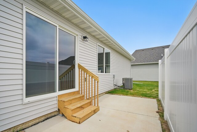view of patio featuring cooling unit and entry steps