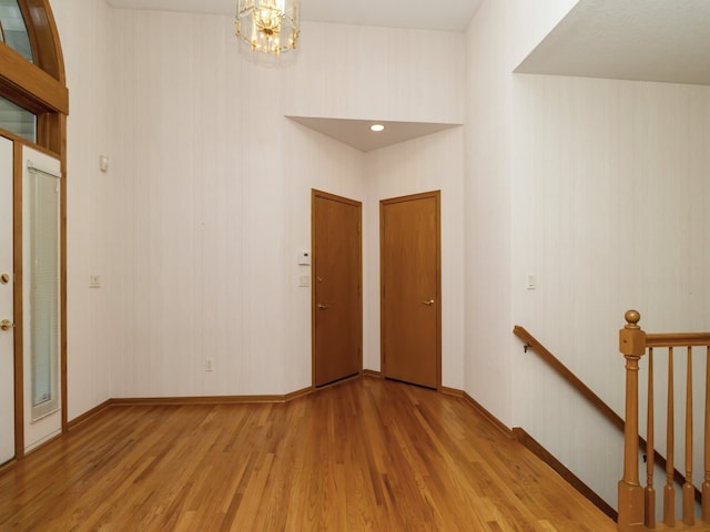 entrance foyer featuring a chandelier and light hardwood / wood-style flooring