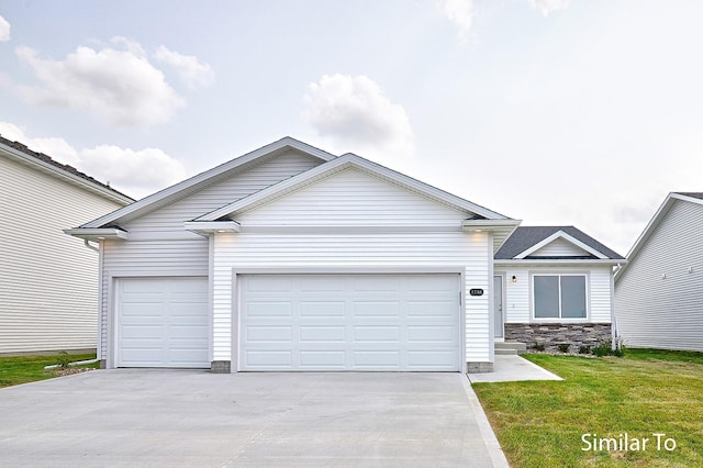 ranch-style home featuring a front lawn and a garage