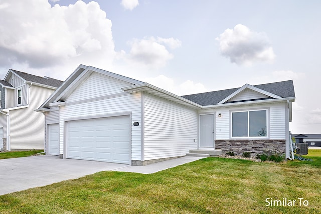 view of front facade with central AC, a front lawn, and a garage