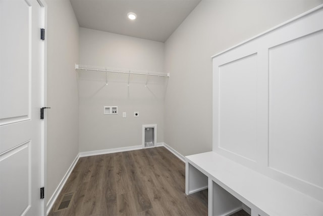 laundry area featuring electric dryer hookup, visible vents, washer hookup, laundry area, and dark wood-style flooring