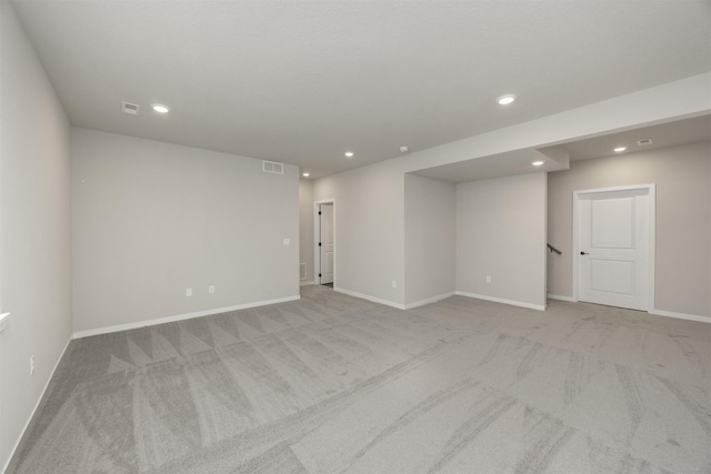 spare room with recessed lighting, visible vents, carpet floors, and baseboards