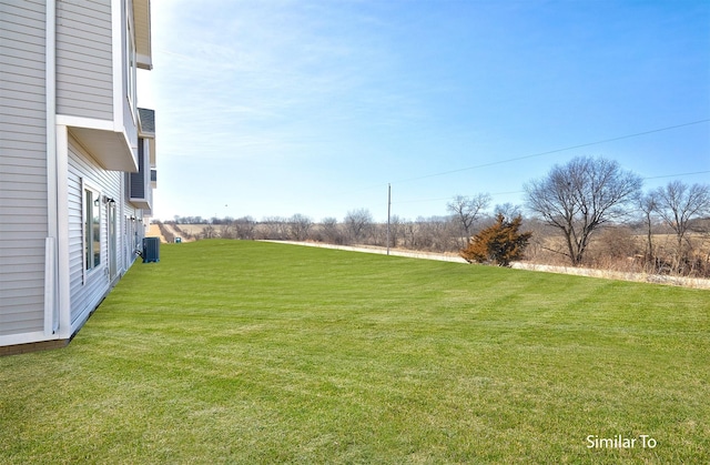 view of yard with central AC