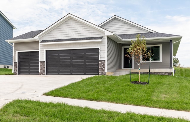 view of front facade with a front lawn and a garage