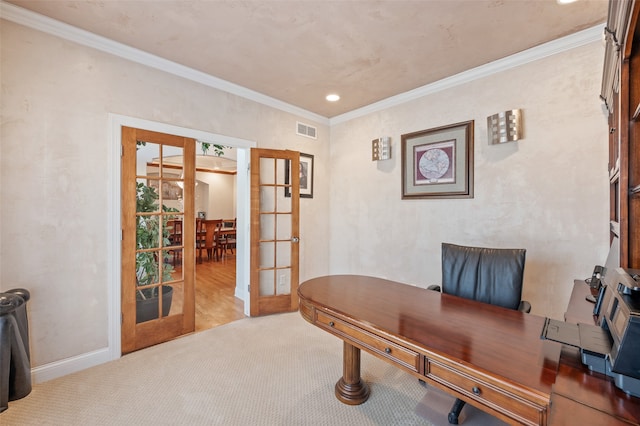 carpeted office space featuring french doors and crown molding