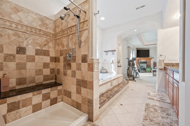 bathroom with vanity, tile patterned floors, and separate shower and tub