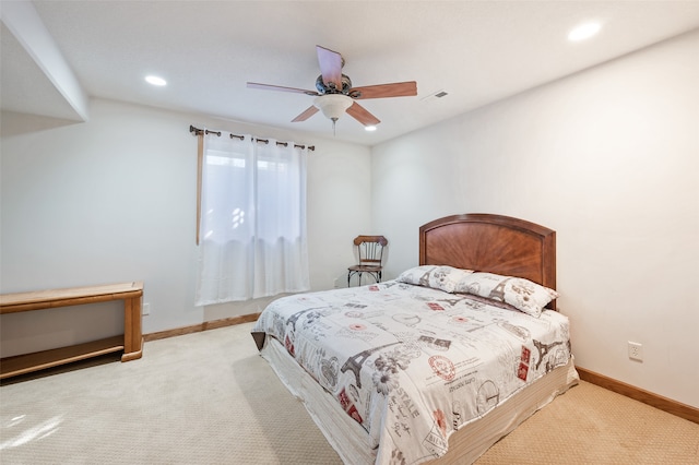 bedroom with light carpet and ceiling fan