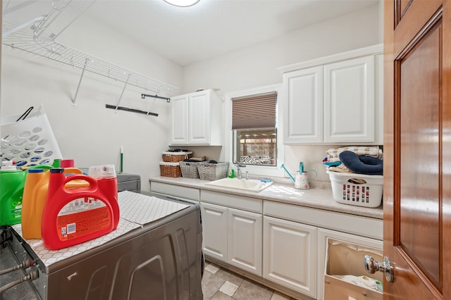 kitchen featuring sink and white cabinetry