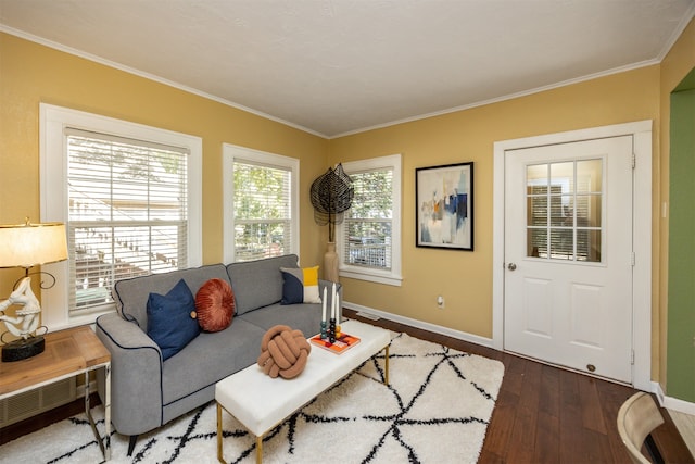 living room with dark wood-type flooring and ornamental molding