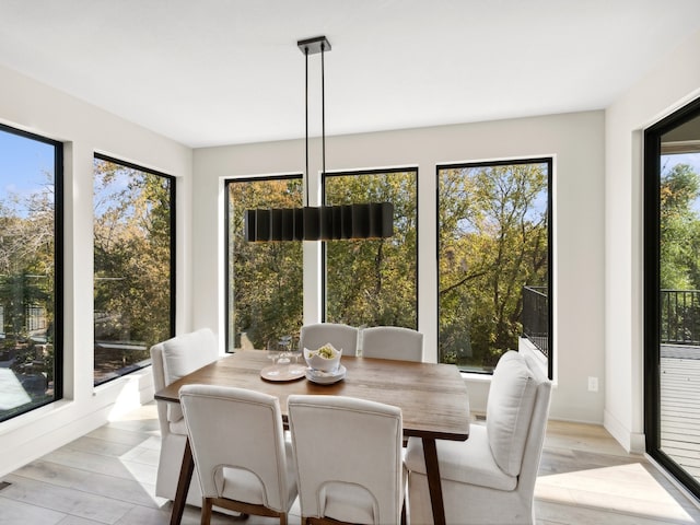 sunroom / solarium featuring a healthy amount of sunlight