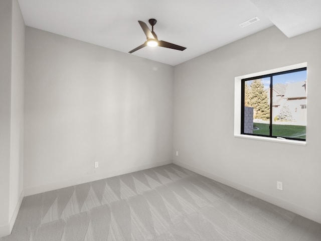 carpeted empty room with ceiling fan