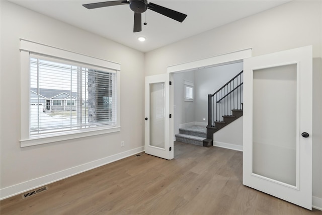 foyer with light wood-type flooring and ceiling fan