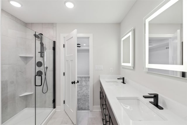 bathroom with vanity, tile patterned floors, and a shower with shower door