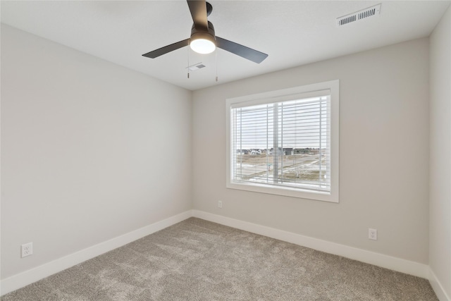 carpeted empty room with ceiling fan