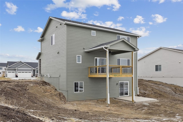 back of property featuring a balcony