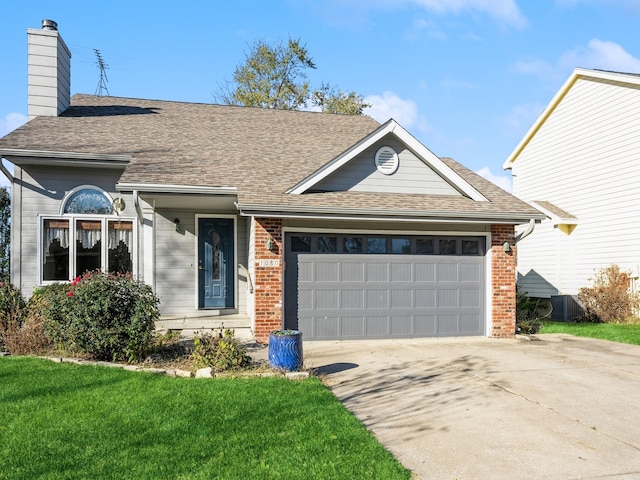 single story home featuring a garage, central AC, and a front yard