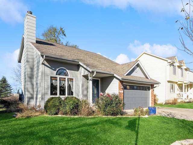 view of front facade featuring a front lawn and a garage