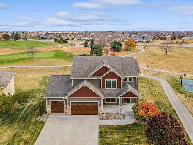 view of front of house with a garage and a front lawn