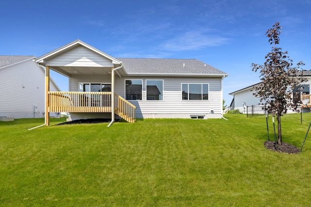 rear view of house with a lawn