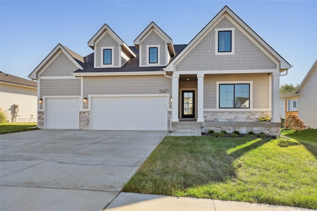 craftsman-style house with a front yard and a garage