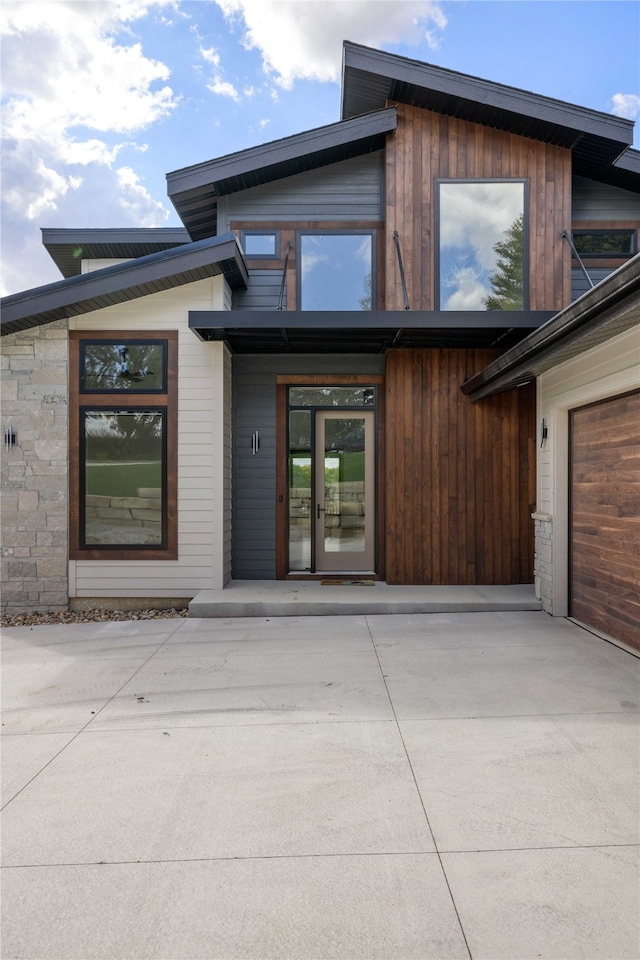 doorway to property featuring a garage