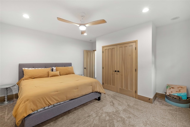 bedroom featuring a closet, ceiling fan, and carpet flooring