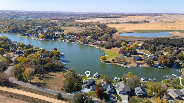 drone / aerial view featuring a water view and a rural view