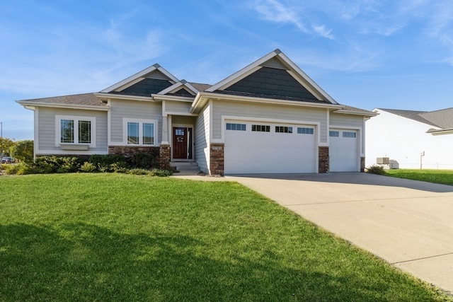 craftsman inspired home featuring a garage, a front lawn, and central air condition unit