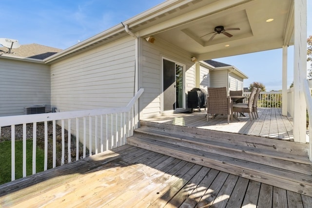 wooden deck with cooling unit and ceiling fan