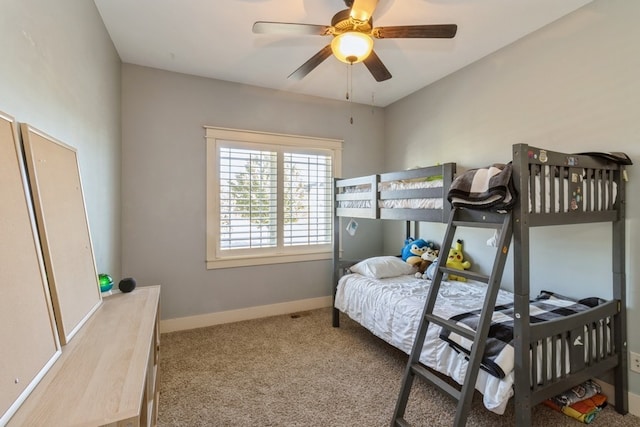 bedroom featuring ceiling fan and carpet