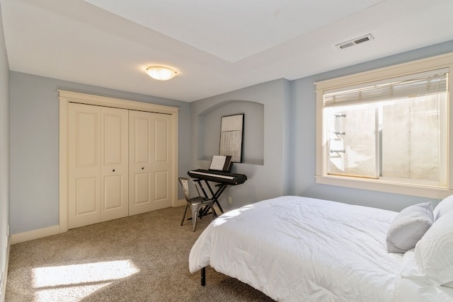 bedroom with a closet and carpet floors