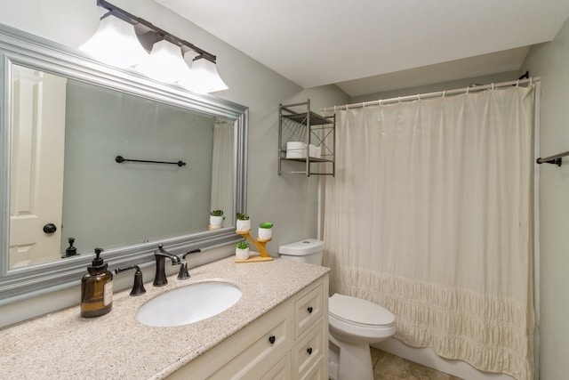 bathroom with toilet, walk in shower, and vanity