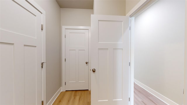 hall with light wood-type flooring