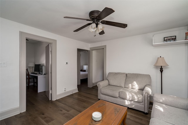 living room with ceiling fan and dark hardwood / wood-style floors