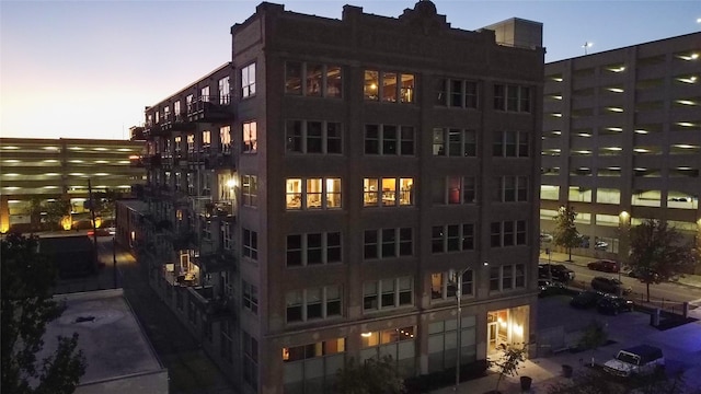 view of outdoor building at dusk