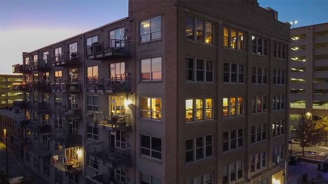 view of outdoor building at dusk